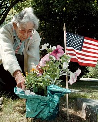 Old lady at gravestone